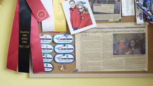 ZACHARY PRONG / WINNIPEG FREE PRESS  A bulletin board in Piper Coffin's room adorned with ribbons, patches and an article about her liver transplant. July 13, 2016.