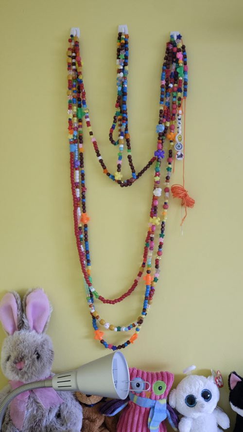 ZACHARY PRONG / WINNIPEG FREE PRESS  Strings of beads, each one representing a different medical procedure, hang in Piper Coffin's bedroom. July 13, 2016.