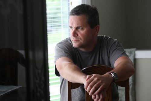 JOE BRYKSA / WINNIPEG FREE PRESS   Kevin Martin, a Winnipeg paramedic currently on leave with PTSD based on horrible awful things he witnessed at a murder scene last month- poses for a photograph in his home-July 13, 2016-(See Mike McIntyre story)