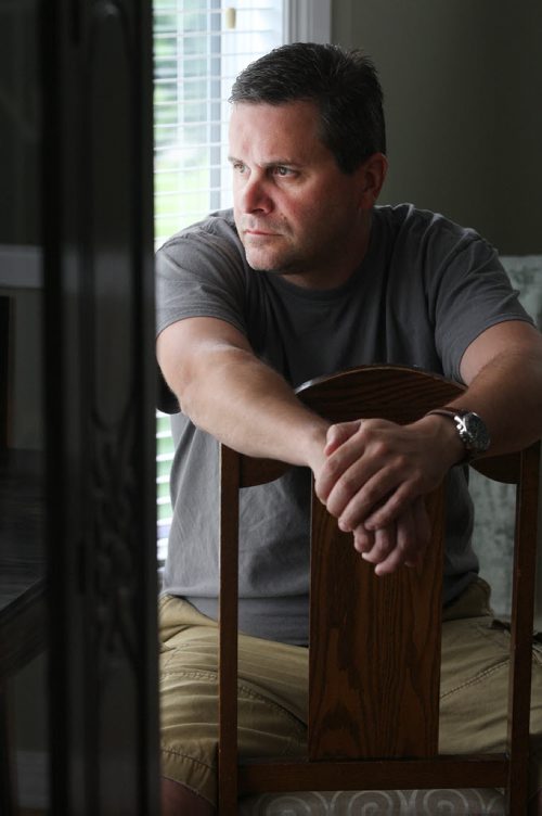 JOE BRYKSA / WINNIPEG FREE PRESS  Kevin Martin, a Winnipeg paramedic currently on leave with PTSD based on horrible awful things he witnessed at a murder scene last month- poses for a photograph in his home-July 13, 2016-(See Mike McIntyre story)