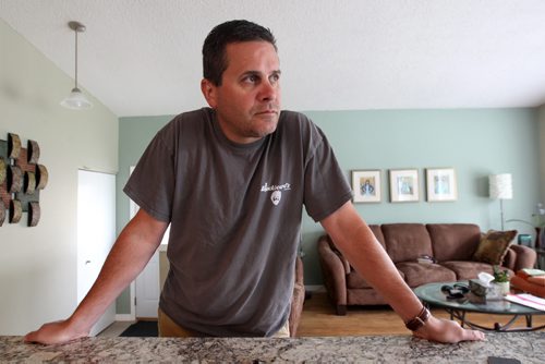 JOE BRYKSA / WINNIPEG FREE PRESS Kevin Martin, a Winnipeg paramedic currently on leave with PTSD based on horrible awful things he witnessed at a murder scene last month- poses for a photograph in his home-July 13, 2016-(See Mike McIntyre story)