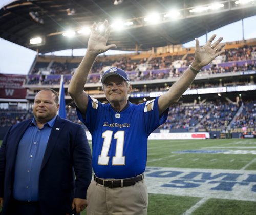 RUTH BONNEVILLE / WINNIPEG FREE PRESS  All-star quarterback Ken Ploen who started with The Winnipeg Blue Bombers in 1957,  was inducted into the Ring of Honour with Bomber CEO Wade Miller  during halftime  of Bombers hosting Eskimos game at Investors Group Stadium Thursday night.    July 14, 2016