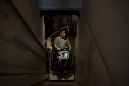 ZACHARY PRONG / WINNIPEG FREE PRESS  Luke Savoie, who doesn't have full use of his hands, is now able to use the elevator in his home with much more ease thanks to HANA. July 14, 2016.