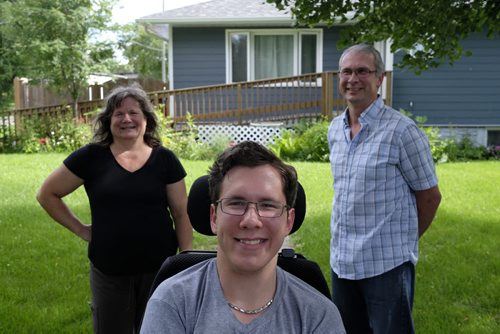 ZACHARY PRONG / WINNIPEG FREE PRESS  Luke Savoie, centre, has been testing a new technology called HANA (Home Access Network Assistant) that allows people with handicaps to control things like lights, doors and the TV with voice commands. It has provided him with a newfound sense of independence, an outcome his parents Joseph and Nancy are both extremely happy with. July 14, 2016.