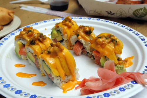 BORIS MINKEVICH / WINNIPEG FREE PRESS Fusian Sushi food: Spicy Mango Roll-Salmon, avocado layered with fresh mango and topped with mango salsa. $11. Winnipeg Free Press food writer Alison Gillmor and FP's Ben MacPhee-Sigurdson, who writes about wine, beer and spirits, test out The Common at the Forks. July 12, 2016