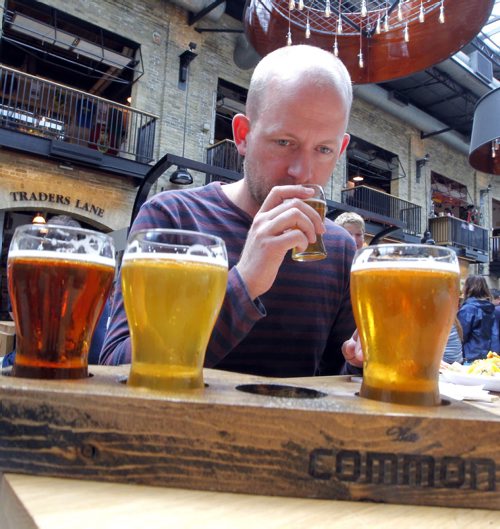 BORIS MINKEVICH / WINNIPEG FREE PRESS Winnipeg Free Press's Ben MacPhee-Sigurdson tests out some beer at The Common located in The Forks. July 12, 2016