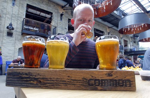 BORIS MINKEVICH / WINNIPEG FREE PRESS Winnipeg Free Press's Ben MacPhee-Sigurdson tests out some beer at The Common located in The Forks. July 12, 2016