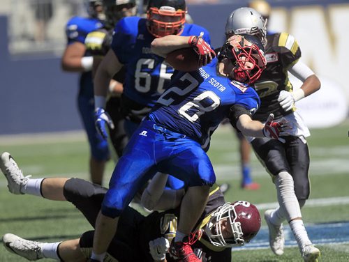 PHIL HOSSACK / WINNIPEG FREE PRESS -   Nova Scotia's #28 Adam Bennet thrashes his way through the Manitoba Gold defence at the Canada Cup football match between the Manitoba Gold Team and Nova Scotia. Scott Billeck story.  See story. July 15, 2016
