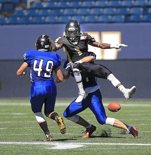 PHIL HOSSACK / WINNIPEG FREE PRESS -   Manitoba Gold receiver #1 Abdul-Karim Gassama goes down in the grip of Nova Scotia's #17 Tyler Ball,  #49 Ethan Clahane closes in at the Canada Cup football match Friday. Scott Billeck story.  See story. July 15, 2016