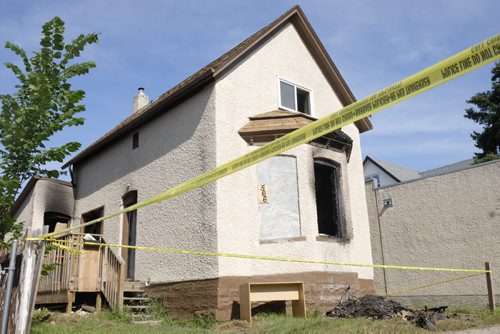 ZACHARY PRONG / WINNIPEG FREE PRESS  A fire on Young St. sent four people to the hospital including one man who is in critical condition. July 16, 2016.