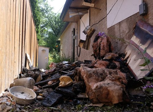 ZACHARY PRONG / WINNIPEG FREE PRESS  The damage to a Fort Garry home after it caught fire on the evening of July 15, 2016. Firefighters forced their way into the home and rescued a woman who was taken to the hospital in serious condition. July 16, 2016.