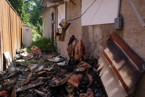 ZACHARY PRONG / WINNIPEG FREE PRESS  The damage to a Fort Garry home after it caught fire on the evening of July 15, 2016. Firefighters forced their way into the home and rescued a woman who was taken to the hospital in serious condition. July 16, 2016.