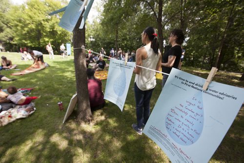 RUTH BONNEVILLE / WINNIPEG FREE PRESS  The "Reflects in Water" art installation, combines statements from people living in Shoal Lake 40 hanging on lines in Steven Juba Park Saturday for and event  to  discuss  the water issues facing his reserve Saturday.    See Alex Paul story.   July 16, 2016