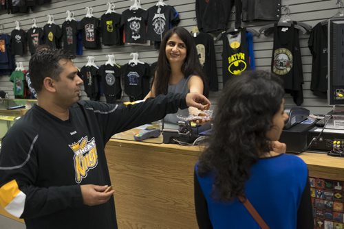 ZACHARY PRONG / WINNIPEG FREE PRESS  Anita Nirula, centre, one of O Calcutta's owners, shares sweets with her friends Mohit Malhotra, left, and Sheba Goklany who stopped by the shop. July 14, 2016.