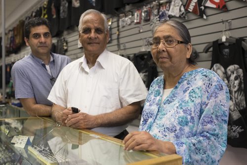 ZACHARY PRONG /  WINNIPEG FREE PRESS  From right to left, Sartaj, Jasbir and Gurinder Nirula, the owners of O Calcutta on Portage Ave. Sartaj and Jasbir opened O Calcutta, a store that sells t-shirts and pop culture paraphernalia, 40 years ago. July 14, 2016.