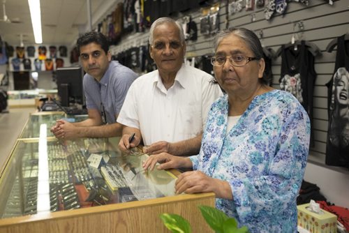 ZACHARY PRONG /  WINNIPEG FREE PRESS  From right to left, Sartaj, Jasbir and Gurinder Nirula, the owners of O Calcutta on Portage Ave. Sartaj and Jasbir opened O Calcutta, a store that sells t-shirts and pop culture paraphernalia, 40 years ago. July 14, 2016.