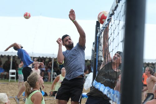 RUTH BONNEVILLE / WINNIPEG FREE PRESS  Anthony Kinch spikes the ball over the net  while playing with his team, Beyond the Norm in the semi-finals against -Don't Dig My Spike in the MTS Super Spike Beach Volleyball Tournament at Maple Grove Rugby Park Saturday.   Standup photo    July 16, 2016