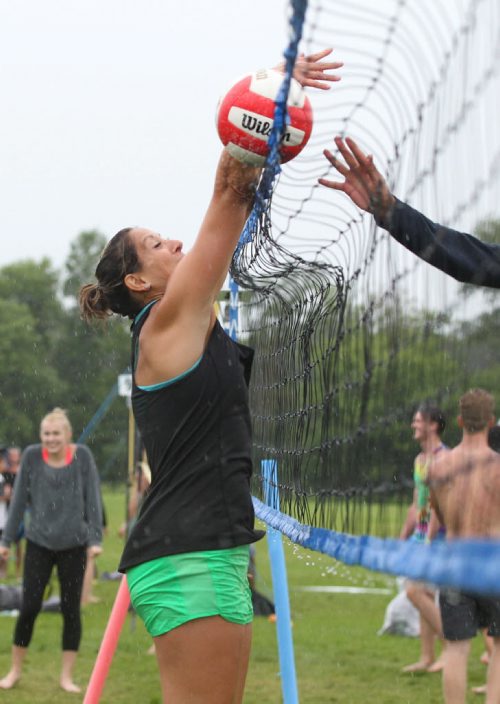 RUTH BONNEVILLE / WINNIPEG FREE PRESS  Jayne Toogood tries to block a ball while playing in the wind and the rain with her team called - Sets Addiction in the MTS Super Spike Beach Volleyball Tournament at Maple Grove Rugby Park Saturday.   Standup photo    July 16, 2016