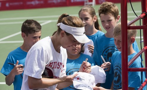 DAVID LIPNOWSKI / WINNIPEG FREE PRESS  Francesca Di Lorenzo of USA signs autographs for ball boys and girls after defeating Erin Routliffe of Canada for the womens singles title at the National Bank Challenger Tennis Tournament at Winnipeg Lawn Tennis Club Sunday July 17, 2016.
