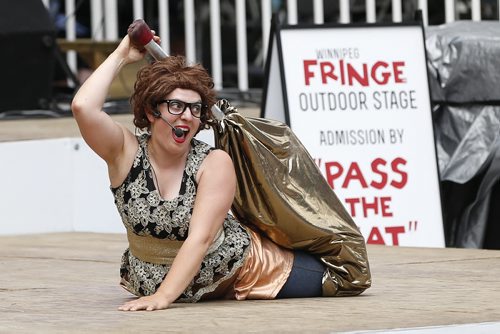 JOHN WOODS / WINNIPEG FREE PRESS Lucinda of street performers Philip and Lucinda performs in their show at the Winnipeg Fringe Festival Sunday, July 17, 2016.