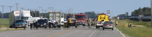 WAYNE GLOWACKI / WINNIPEG FREE PRESS     Emergency crews at the collision scene involving a semitrailer and a car on Highway 6 near Grosse Isle. Monday morning. The crash closed the section on Highway 6 between Highways 67 and 322.  July 18 2016