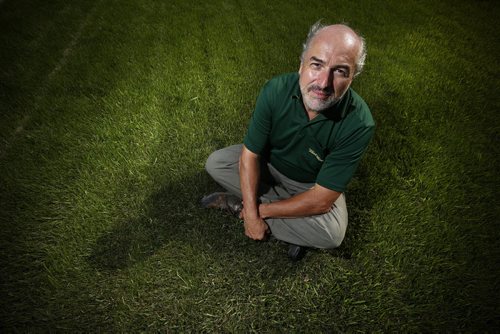 JOHN WOODS / WINNIPEG FREE PRESS David Hinton, co-owner Weed Man Winnipeg, sits in a weed-free lawn Monday, July 18, 2016. The recently elected Manitoba PC government is looking into the NDP's 2 year ban on weed killers.