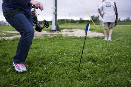 ZACHARY PRONG / WINNIPEG FREE PRESS  A member of the Robin Hood Archery Club fetchers her arrow. It is believed pole archery has been practiced since the 14th century. July 13, 2016.
