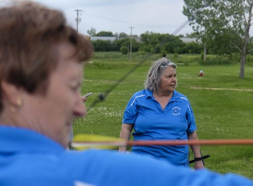 ZACHARY PRONG / WINNIPEG FREE PRESS  Deb Clark, a member of the St. Sebastianette Archery Club, watches as ____ takes a shot. June 29, 2016.