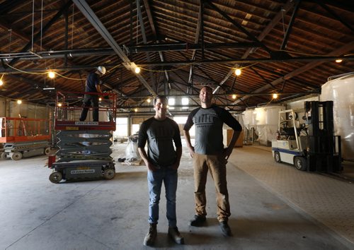 WAYNE GLOWACKI / WINNIPEG FREE PRESS  At left, Kevin Selch founder of Little Brown Jug Brewing Company and  brewmaster Bernhard Wieland in their new brewery under construction on William Ave. Ben MacPhee-Sigurdson¤story     July 19 2016