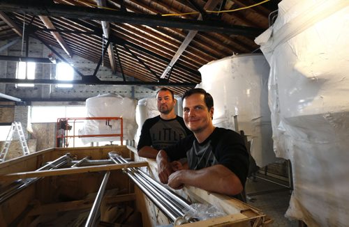 WAYNE GLOWACKI / WINNIPEG FREE PRESS  At right, Kevin Selch founder of Little Brown Jug Brewing Company and  brewmaster Bernhard Wieland in their new brewery under construction  on William Ave. Ben MacPhee-Sigurdson¤story     July 19 2016