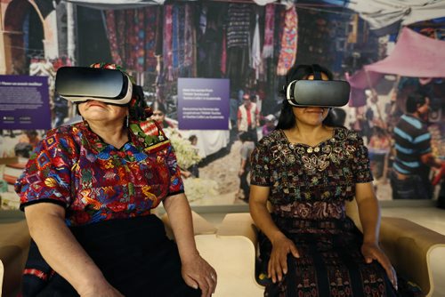 WAYNE GLOWACKI / WINNIPEG FREE PRESS  Seated at left is Amparo de León and Oralia Chopén, two Guatemalan Maya women artisans try out the virtual reality googles Tuesday to view scenes from their Trama Textiles co-operative in Guatemala that is part of the Canadian Museum for Human Rights exhibit called Empowering Women: Artisan Cooperative that Transform Communities. "The exhibition explores how working collectively enables women to support their families, transform their communities and preserve their traditional arts.  Carol  Sanders story     July 19 2016
