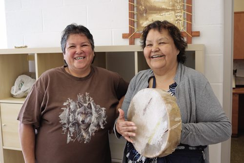 Canstar Community News July 11, 2016 - Language teacher Gloria Barker (left) and Elder at Amber Trails School Millie Moar (right) singing Indigenous songs and playing the drums. (Ligia Braidotti/Canstar Community News)