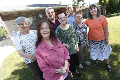 JOHN WOODS / WINNIPEG FREE PRESS Shalom Residences Inc residents (front from left) Roz Bubbis, Barbara Steele, Susan Tax and executive director Nancy Hughes are photographed outside their intellectual disabilities group home with founders (back from left) Sybil Steele, Frank Steele and president Charles Tax Tuesday, July 19, 2016. Shalom Residences Inc. is a non-profit organization, which provides care and support, in community based homes for adults with intellectual disabilities in a Jewish milieu.