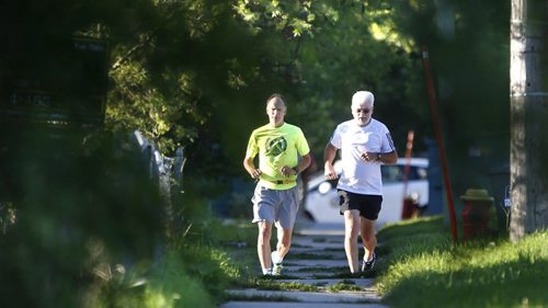 WAYNE GLOWACKI / WINNIPEG FREE PRESS   John Graham,right, and Ray Hesslein were out for a jog Wednesday morning along Tache Ave. before the afternoon temperatures are expected to rise to 33C.  July 20 2016
