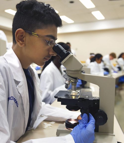 WAYNE GLOWACKI / WINNIPEG FREE PRESS   Abdul Saboor Khizar uses a microscope to see the cells of an onion skin in a workshop during Biomedical Youth Camp Wednesday. Students in Grades 5 to 12 have the opportunity to participate in 10 of 16 science-focused workshops in a university atmosphere, The Rady Faculty of Health Sciences-hosted the event at the University of Manitoba Bannatyne Campus.   Ashley Prest story July 20 2016