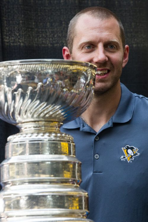 MIKE DEAL / WINNIPEG FREE PRESS Pittsburgh Penguins forward Eric Fehr spent the afternoon at the Southland Mall in Winkler, Manitoba pose with fans for photographs with the Stanley Cup. 160720 - Wednesday, July 20, 2016