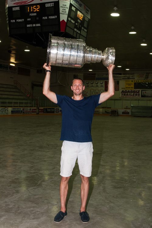 PHOTO BY ART WIEBE  Pittsburgh Penguins forward Eric Fehr with the Stanley Cup in the hockey arena in Winkler, Manitoba Wednesday morning. 160720 - Wednesday, July 20, 2016