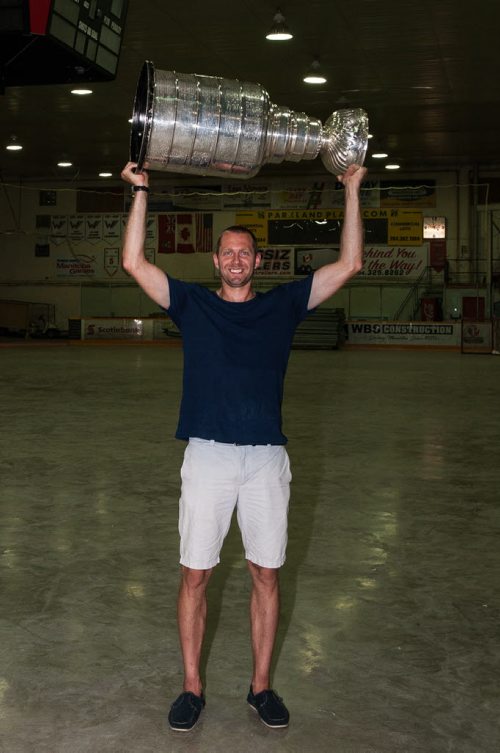 PHOTO BY ART WIEBE  Pittsburgh Penguins forward Eric Fehr with the Stanley Cup in the hockey arena in Winkler, Manitoba Wednesday morning. 160720 - Wednesday, July 20, 2016