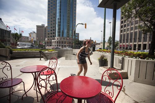 RUTH BONNEVILLE / WINNIPEG FREE PRESS  Photos of the corner of Portage Ave. and Main Street for story on opening the intersection up for pedestrian traffic.  Jamie Butler skates around the south east corner of the intersection Wednesday.      July 20, 2016