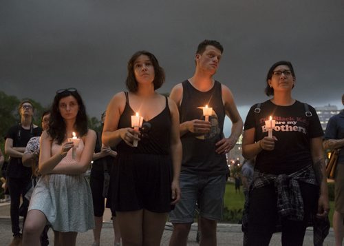 ZACHARY PRONG / WINNIPEG FREE PRESS  People hold candles at a Black Lives Matter Vigil at the Legislative Building. July 20, 2016.