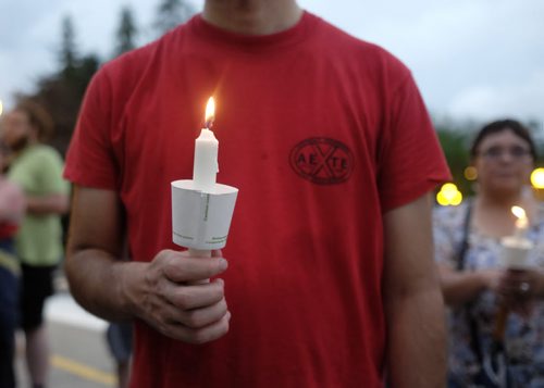 ZACHARY PRONG / WINNIPEG FREE PRESS  A protestor holds a candle at the Legislative Building for a Black Lives Matter Vigil. July 20, 2016.