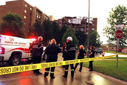 BORIS MINKEVICH / WINNIPEG FREE PRESS One side of an apartment complex called Parkway Plaza at 2000 Sinclair (near Leila) was victim to a vicious storm that passed through Winnipeg this evening. It ripped the roof off one building. July 20, 2016