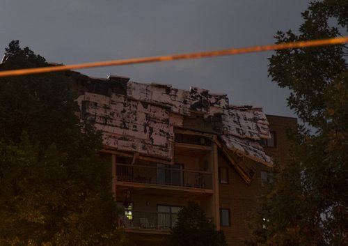 ZACHARY PRONG / WINNIPEG FREE PRESS  The roof of an apartment building on Sinclair was torn off during a severe thunderstorm on Friday evening. July 20, 2016.