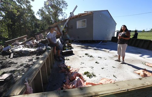 John and Frieda Meeches in the foundation of their home on the Long Plain First Nation after a tornado moved and destroyed the house Wednesday night.     Ashley Prest story  July 21 2016