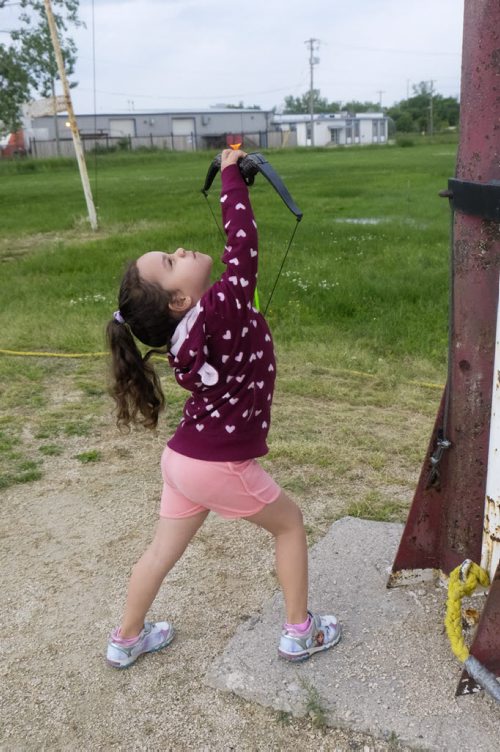 ZACHARY PRONG / WINNIPEG FREE PRESS  Aubree Razella, 4, a member of the St. Sebastian Archery Club, takes a shot with her toy bow and arrow. June 29, 2016.