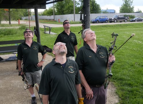 ZACHARY PRONG / WINNIPEG FREE PRESS  Members of the Robin Hood Archery Club scan the sky for an arrow. From left to right, Mark Richter, Keith Lorass, Chad Swayze and Reg Bergmann. June 29, 2016.
