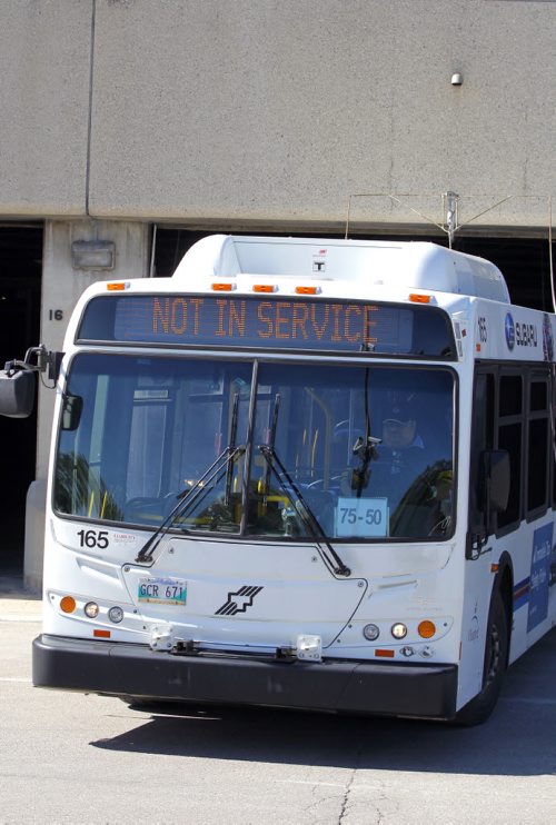 BORIS MINKEVICH / WINNIPEG FREE PRESS General Winnipeg Transit garage photos taken at 421 Osborne St. Photos taken from the sidewalk of the garages with open doors. July 21, 2016