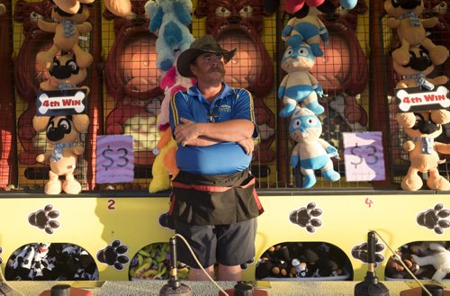 ZACHARY PRONG / WINNIPEG FREE PRESS  Tim Alberts at his game booth at the Morris Stampede. In addition to grandstand performances families can enjoy rides, games, live music and food. July 21, 2016.