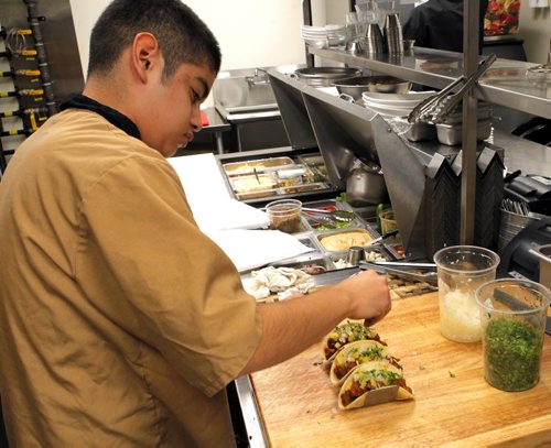 BORIS MINKEVICH / WINNIPEG FREE PRESS RESTAURANT REVIEW -  La Roca. 155 Smith Street. Mexican food.  This photo cook Edwin Quintanilla preparing some Pastor Tacos.  July 21, 2016