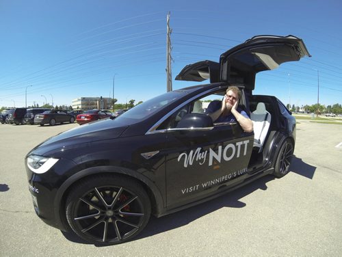 Tyler Walsh / Winnipeg Free Press  Free Press humour columnist Doug Speirs sits in the 2015 Tesla Model X at Nott Autocorp. The fully electric Tesla vehicle features autopilot mode which allows drivers to hand over control to the vehicle.   July 22/16